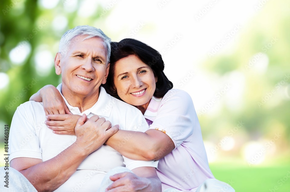 Naklejka premium Happy active old senior couple hugging in park