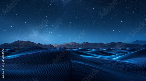 The dark blue sand dunes under the starry night sky
