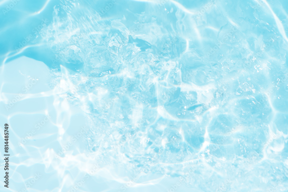 Blue water with ripples on the surface. Defocus blurred transparent blue colored clear calm water surface texture with splashes and bubbles. Water waves with shining pattern texture background. Blue water with ripples on the surface. Defocus blurred transparent blue colored clear calm water surface texture with splashes and bubbles. Water waves with shining pattern texture background.