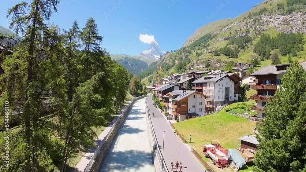 Zermatt, Switzerland, Europe in spring, flight towards Matterhorn and Swiss Alps mountains in the background.