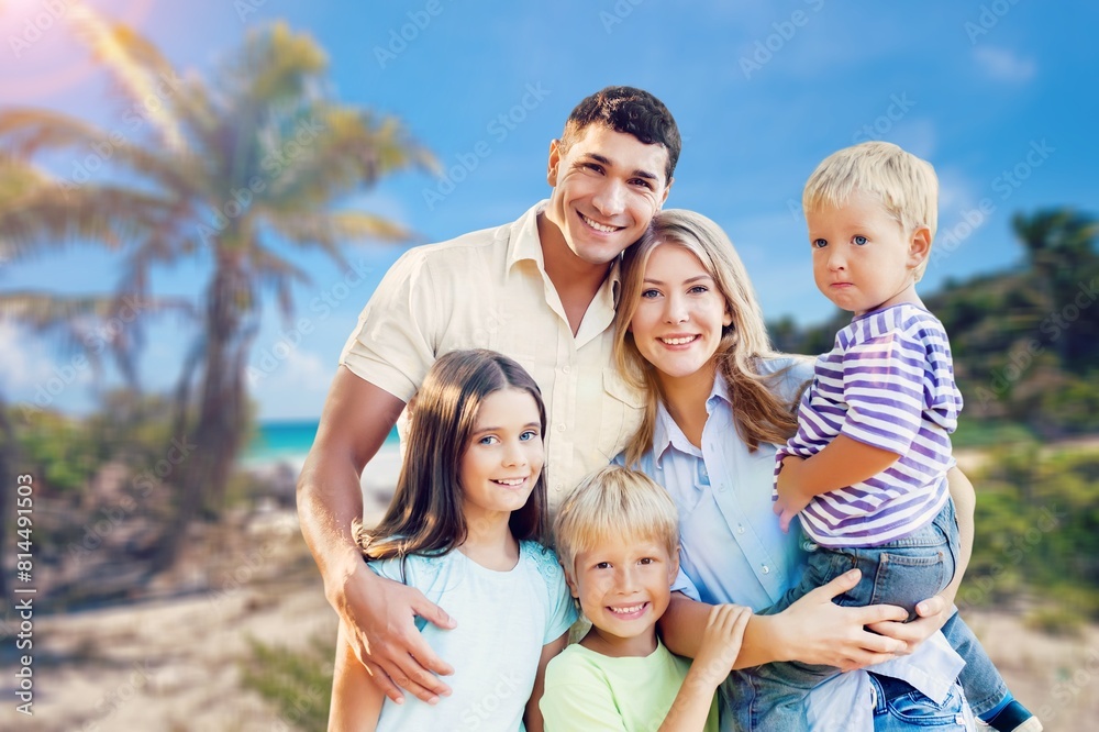 Happy family fun together on a sandy beach Happy family fun together on a sandy beach