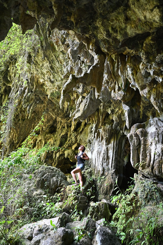 Tourist girl surveys the surroundings of the El Nicho cave in Cuba