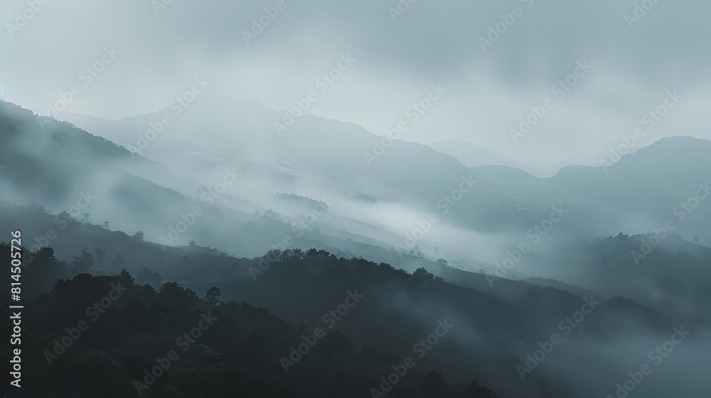 Outlines of distant hills barely visible through misty haze wallpaper