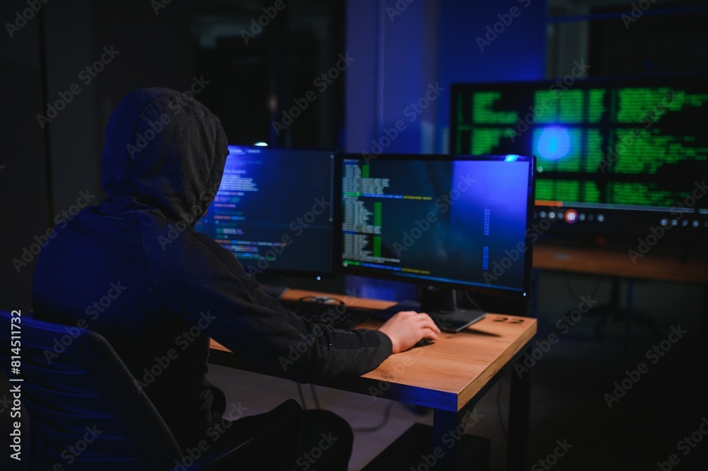 Wanted hackers coding virus ransomware using laptops and computers. Cyber attack, system breaking and malware concept Wanted hackers coding virus ransomware using laptops and computers. Cyber attack, system breaking and malware concept