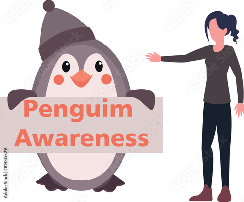 Girl pointing to a penguin awareness board.