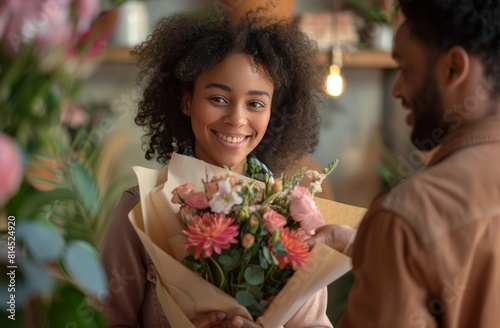 Woman Holding Bouquet of Flowers Next to Man