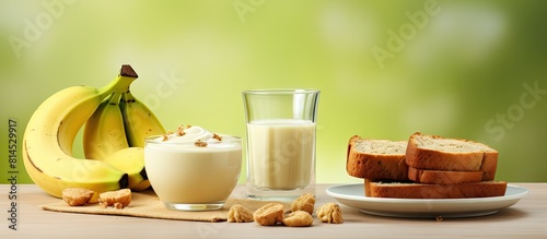 A delectable combination of banana and cream bread accompanied by a refreshing cup of milk tea creating a tasteful and satisfying treat Don t forget the copy space image 143 characters