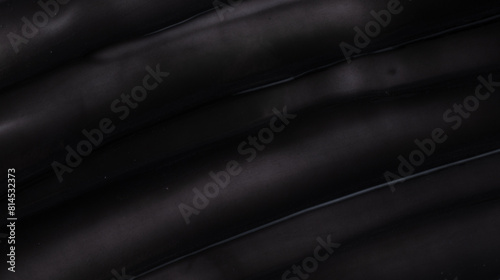 Texture of black charcoal face mask. Abstract black charcoal toothpaste or hair dye background for design. © Inna Dodor