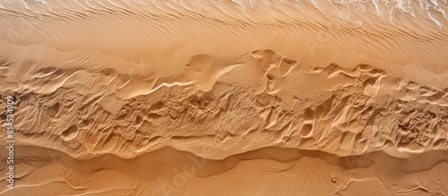 Top view of a sandy beach f...