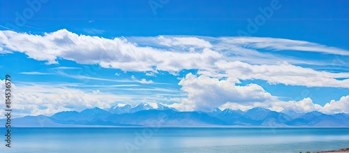 A picturesque landscape of QingHai lake with a panoramic view showcasing the serene bluesky and tranquil lake waters ideal for copy space images photo