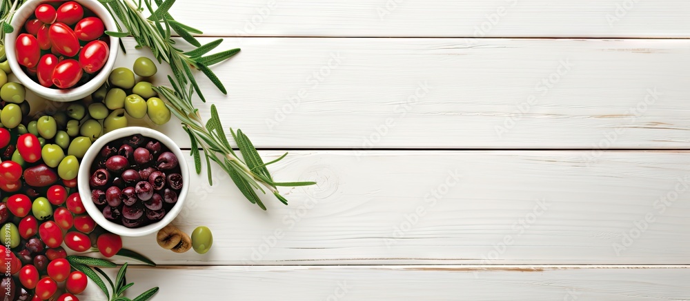Greek cuisine offers traditional appetizers featuring fresh branches of olives in vibrant green and red hues against a backdrop of a white wooden surface providing ample copy space for customization Greek cuisine offers traditional appetizers featuring fresh branches of olives in vibrant green and red hues against a backdrop of a white wooden surface providing ample copy space for customization