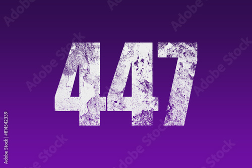 flat white grunge number of 447 on purple background. photo