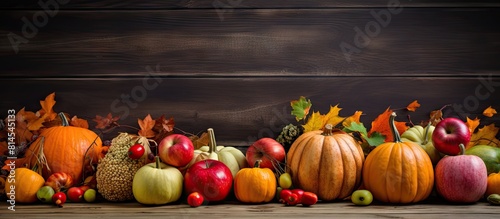 A healthy eating composition featuring autumn pumpkins apples and rosehips arranged on a wooden table A high quality image with copy space