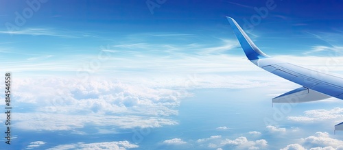Capture images of the vibrant blue sky from the airplane leaving ample space for creative use or text overlay