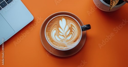 Cup of Coffee on Table Next to Laptop