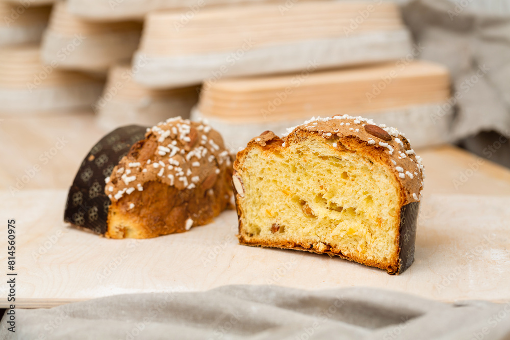 Homemade muffin with nuts and raisins in a cut on the table