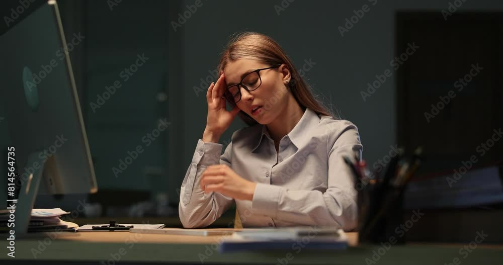 Tired businesswoman taking off glasses in front of computer at work late at night 4k movie slow motion. Vision problems when working at computer for long time concept Tired businesswoman taking off glasses in front of computer at work late at night 4k movie slow motion. Vision problems when working at computer for long time concept