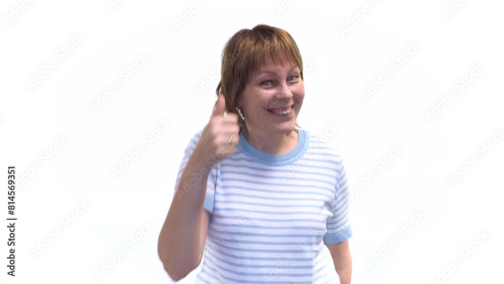 A young woman expresses joy and victory by smiling and gesturing A young woman expresses joy and victory by smiling and gesturing
