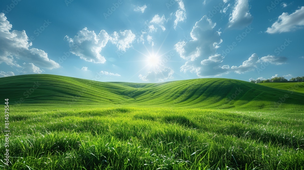 Beautiful green grassy hills under blue sky with white clouds.