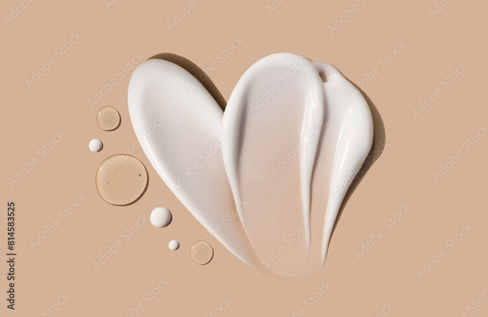 composition of brush strokes of creamy texture of cosmetic samples on a pastel beige background composition of brush strokes of creamy texture of cosmetic samples on a pastel beige background