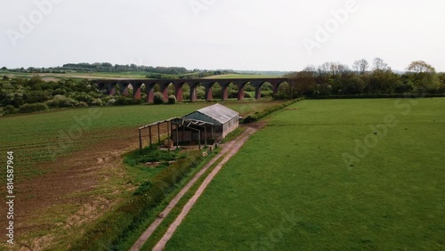 Aerial view 4k flying around Twyford viaduct on a bright but hazy day in England. Cinematic. photo