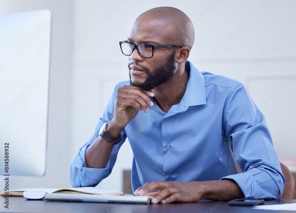 Black man, office and thinking with computer for online research, information and ideas in start up company. Project manager, notebook and browsing or reading on internet website for business growth Black man, office and thinking with computer for online research, information and ideas in start up company. Project manager, notebook and browsing or reading on internet website for business growth