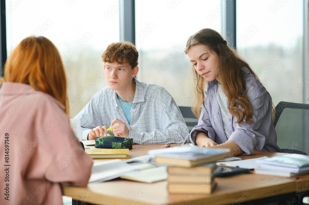 Students studying in library or classroom Students studying in library or classroom