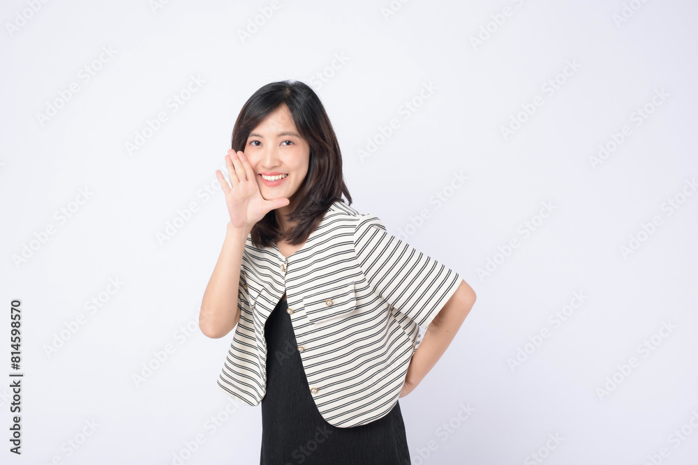 Asian woman is posing with a shouting gesture against a white background. Asian woman is posing with a shouting gesture against a white background.