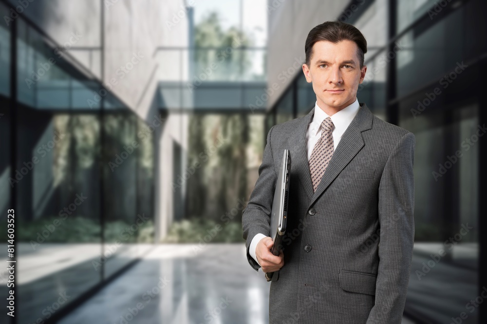 Happy young businessman leader standing in office. Happy young businessman leader standing in office.