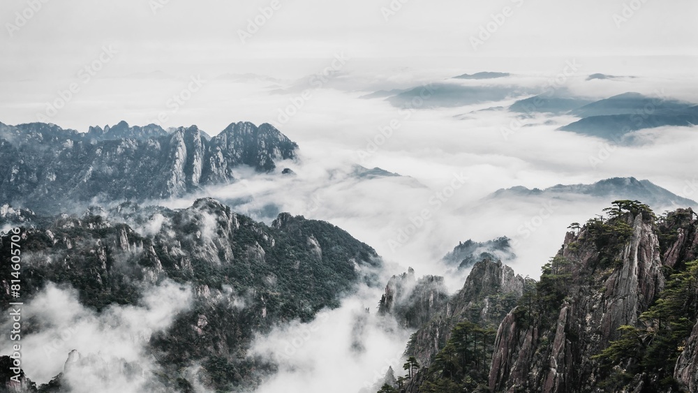 Aerial view of Mount Huangshan covered with clouds in Anhui, China Aerial view of Mount Huangshan covered with clouds in Anhui, China