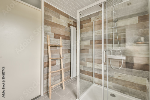 Contemporary wooden tiled bathroom with glass shower photo