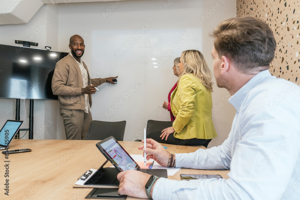 Diverse team engaging in a coworking space meeting Diverse team engaging in a coworking space meeting