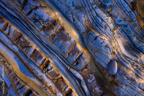 Textured Rock Surface with Contrasting Colors and Patterns