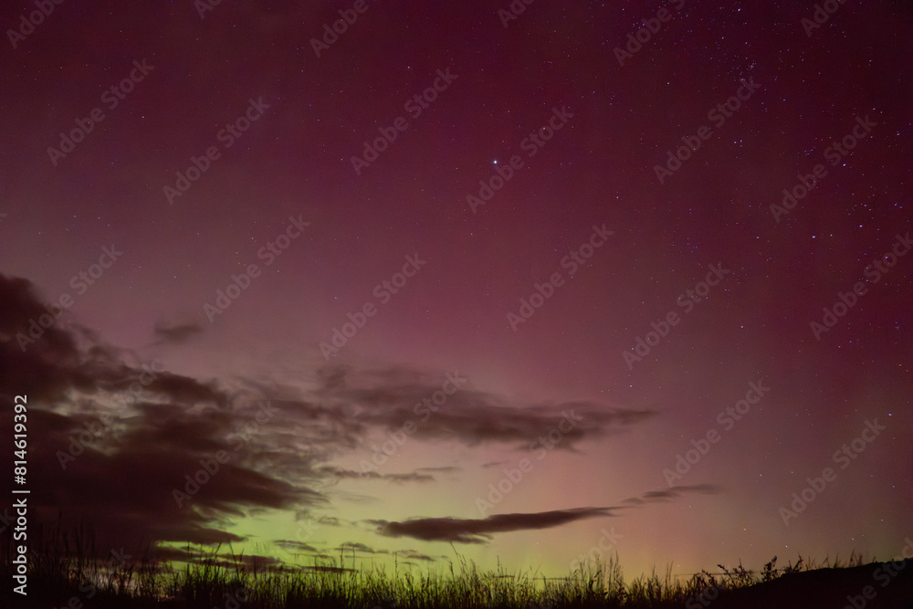 Red and yellow sky glow of Aurora Australis over Matakaea (Shag Point) in the South Island of New Zealand during the widely seen aurora of May 2024. Red and yellow sky glow of Aurora Australis over Matakaea (Shag Point) in the South Island of New Zealand during the widely seen aurora of May 2024.
