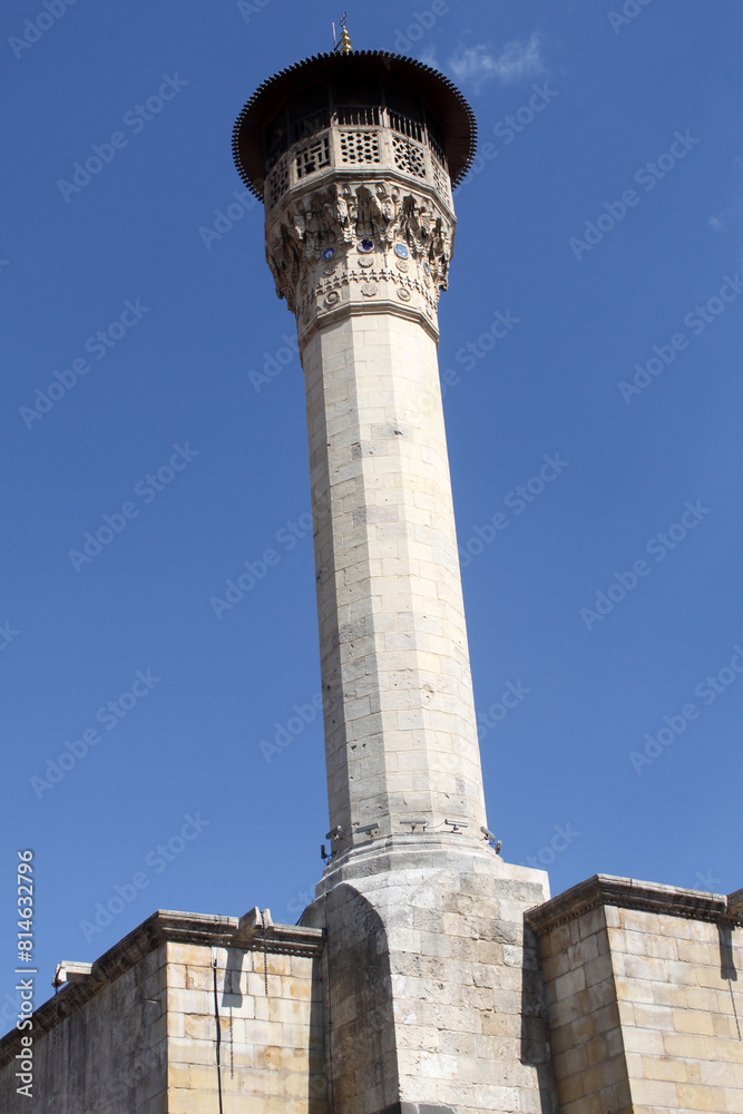 Historical mosque minaret with blue sky. Mosque view in Gaziantep,Turkey