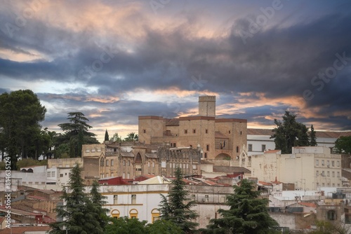 Cloudy and colorful sunset in the city and capital of Badajoz with the Alcazaba on top. Extremadura. photo