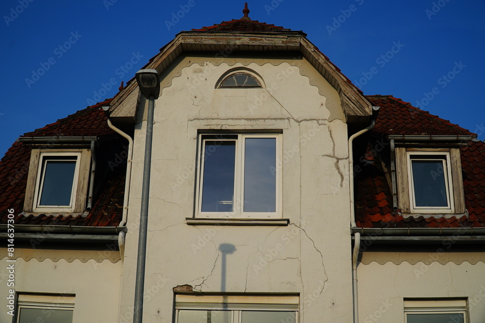 Settling cracks in house facade in Garbsen Berenbostel, Lower Saxony, Germany. Settling cracks in house facade in Garbsen Berenbostel, Lower Saxony, Germany.