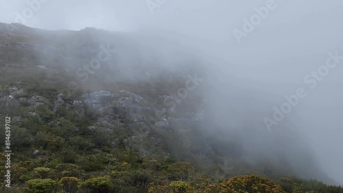 Dense fog covering the Badacsony Volcano Valley at sunrise in Badacsonytomaj Village, Hungary photo