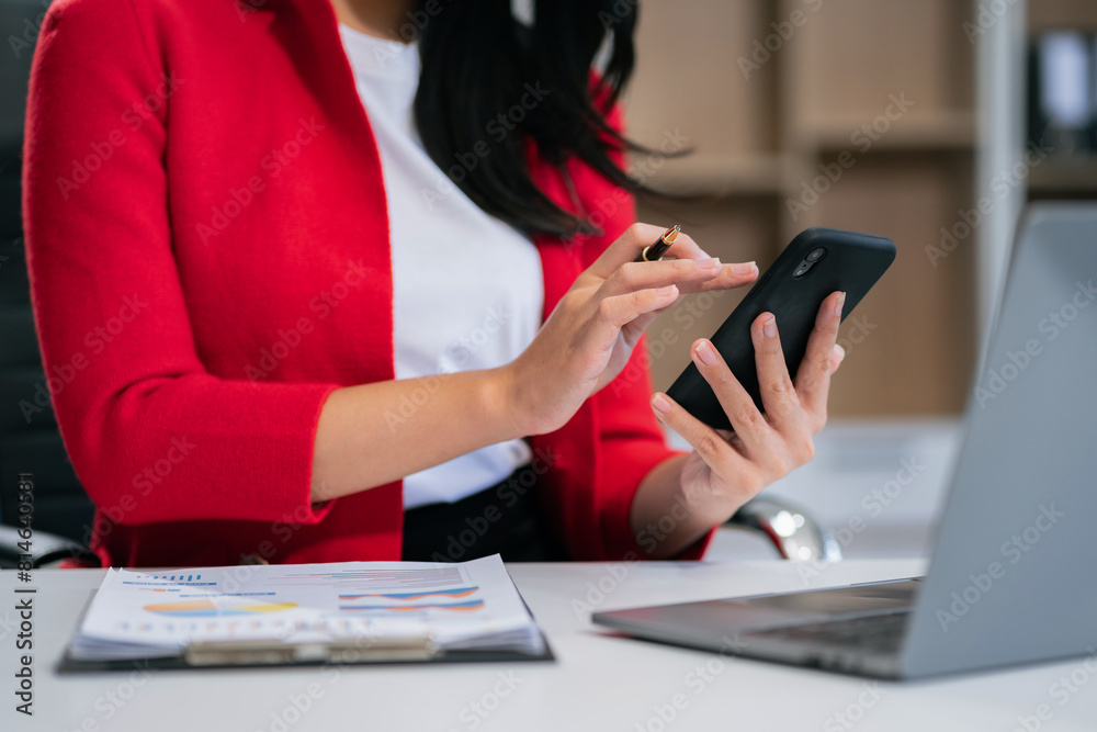 Businesswoman play with smart phones with laptop computers with social media layouts. Businesswoman play with smart phones with laptop computers with social media layouts.