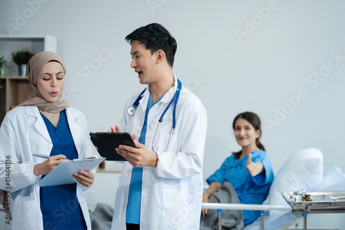 medicine  healthcare and people concept - doctor talking to male patient at bed in hospital.