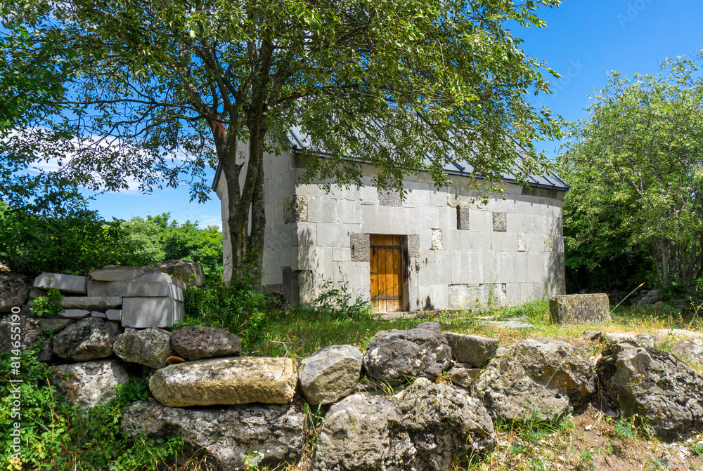 The church is faced with light stone, a wooden door, a fence made of large stones. Samshvilde, Georgia The church is faced with light stone, a wooden door, a fence made of large stones. Samshvilde, Georgia