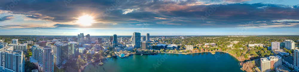 Fototapeta premium Panoramic aerial view of Orlando skyline along Lake Eola at sunset, Florida