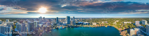 Panoramic aerial view of Orlando skyline along Lake Eola at sunset, Florida