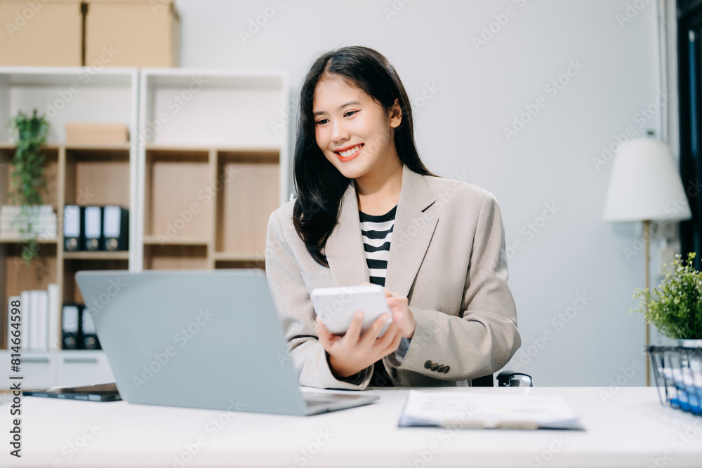 Business woman using tablet and laptop for doing math finance on an office desk, tax Business woman using tablet and laptop for doing math finance on an office desk, tax