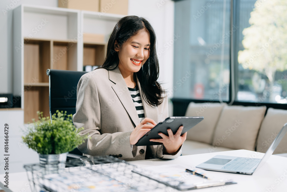 Business woman using tablet and laptop for doing math finance on an office desk, tax Business woman using tablet and laptop for doing math finance on an office desk, tax