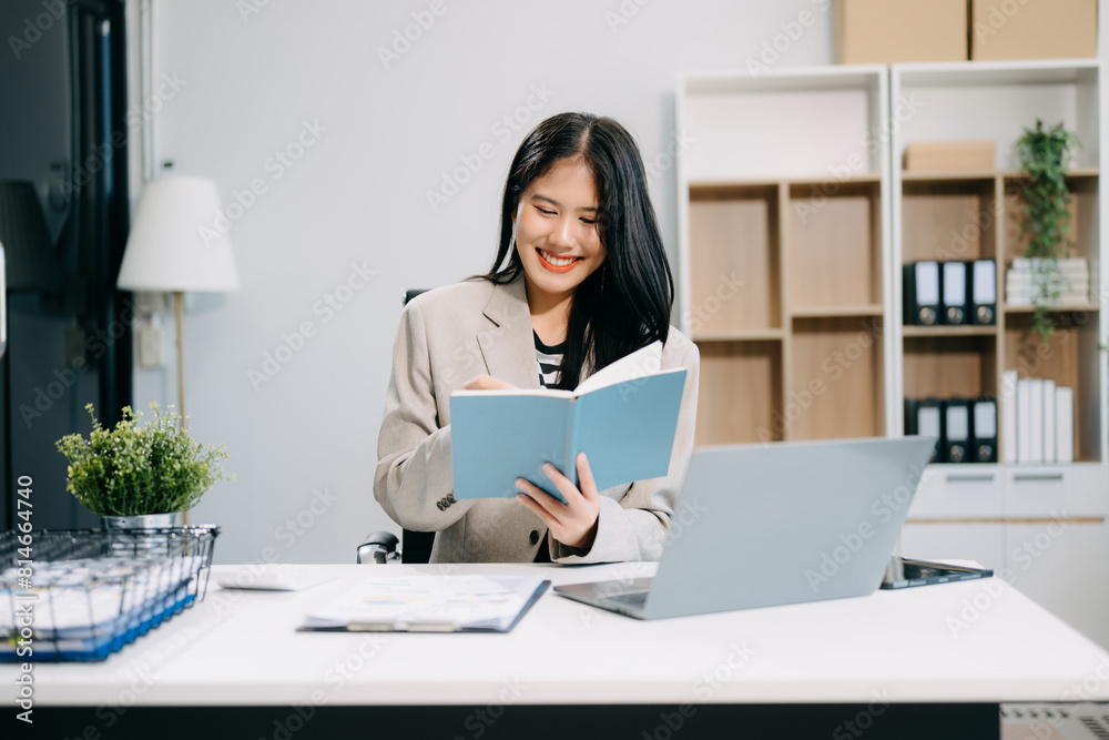 Business woman using tablet and laptop for doing math finance on an office desk, tax Business woman using tablet and laptop for doing math finance on an office desk, tax