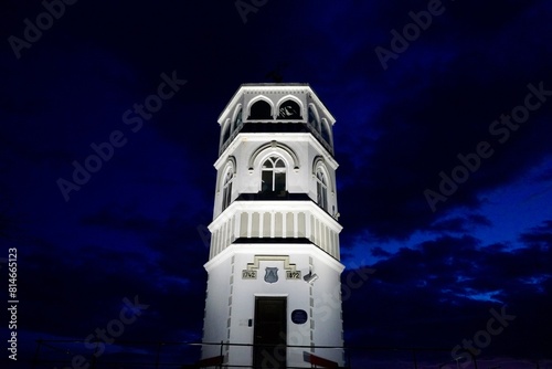 Fire watch tower at Varden against a cloudy night sky in Kristiansund, Norway photo