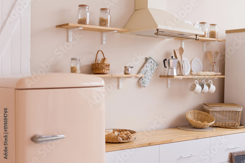 Bright kitchen interior with beige walls
