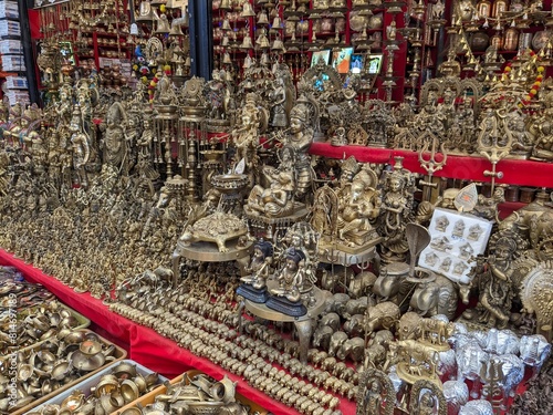 Market Treasures: Bronze Hindu God Statues Gleaming in the Light