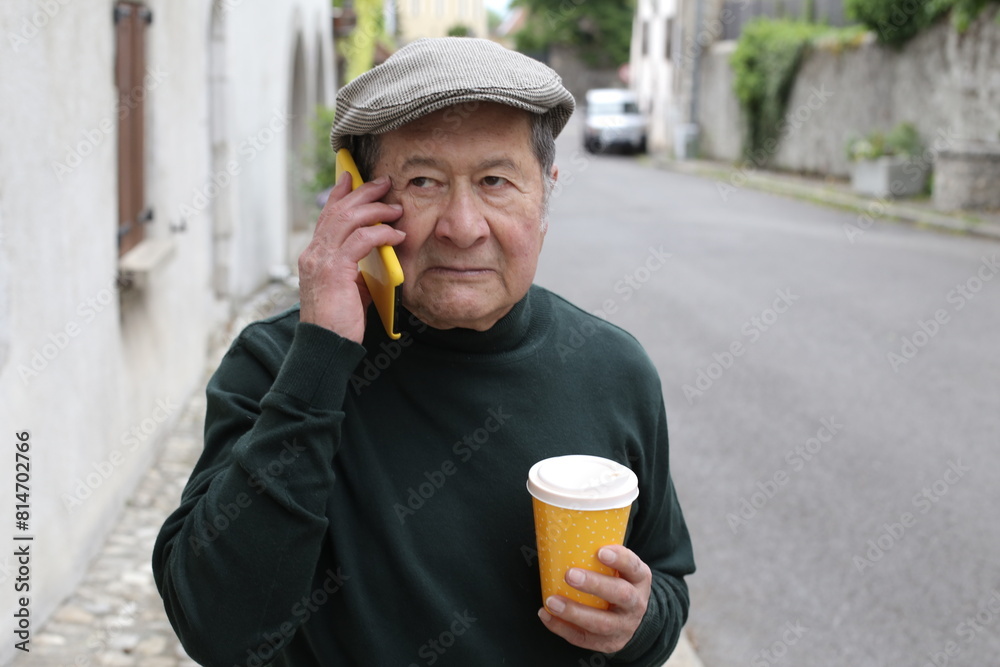 Fototapeta premium Frustrated senior Hispanic man on the phone 